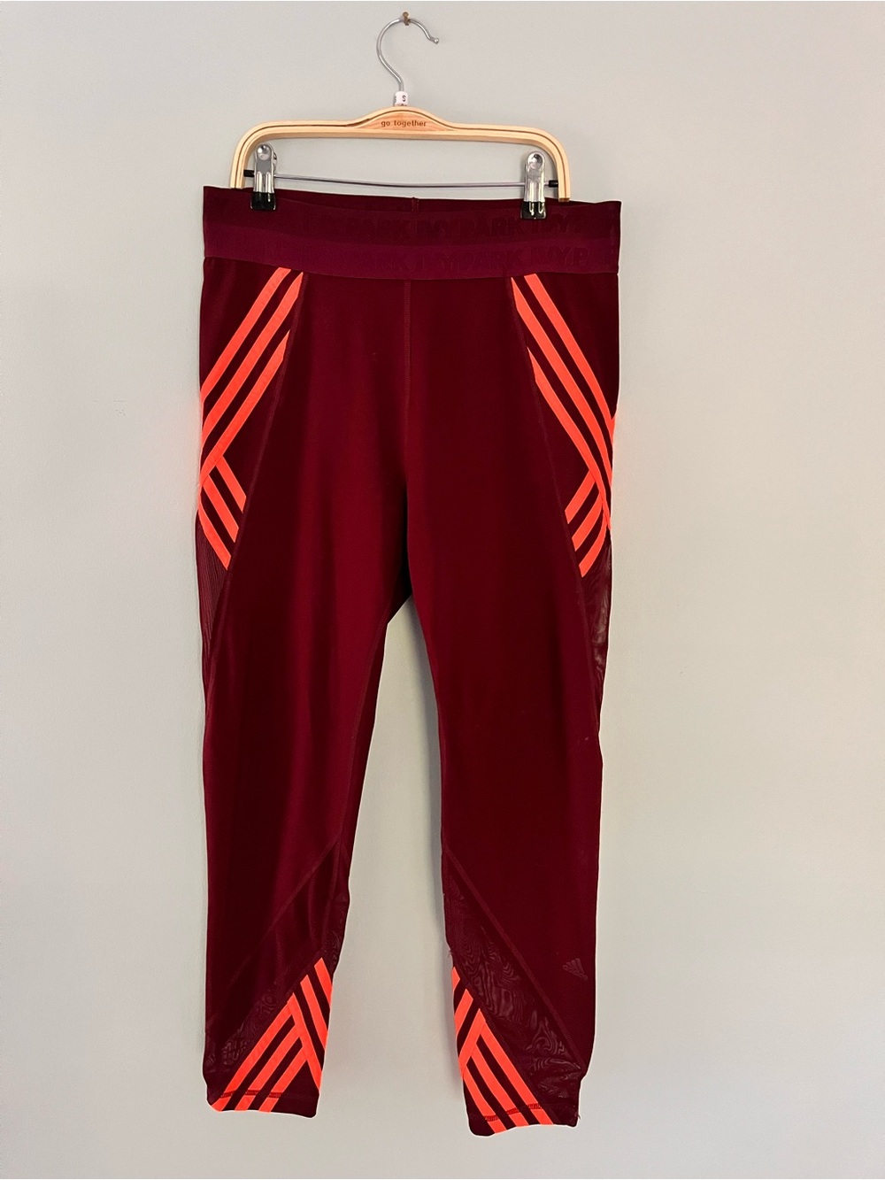 IVY PARK Burgundy Leggings with Neon Orange Stripe Accents
